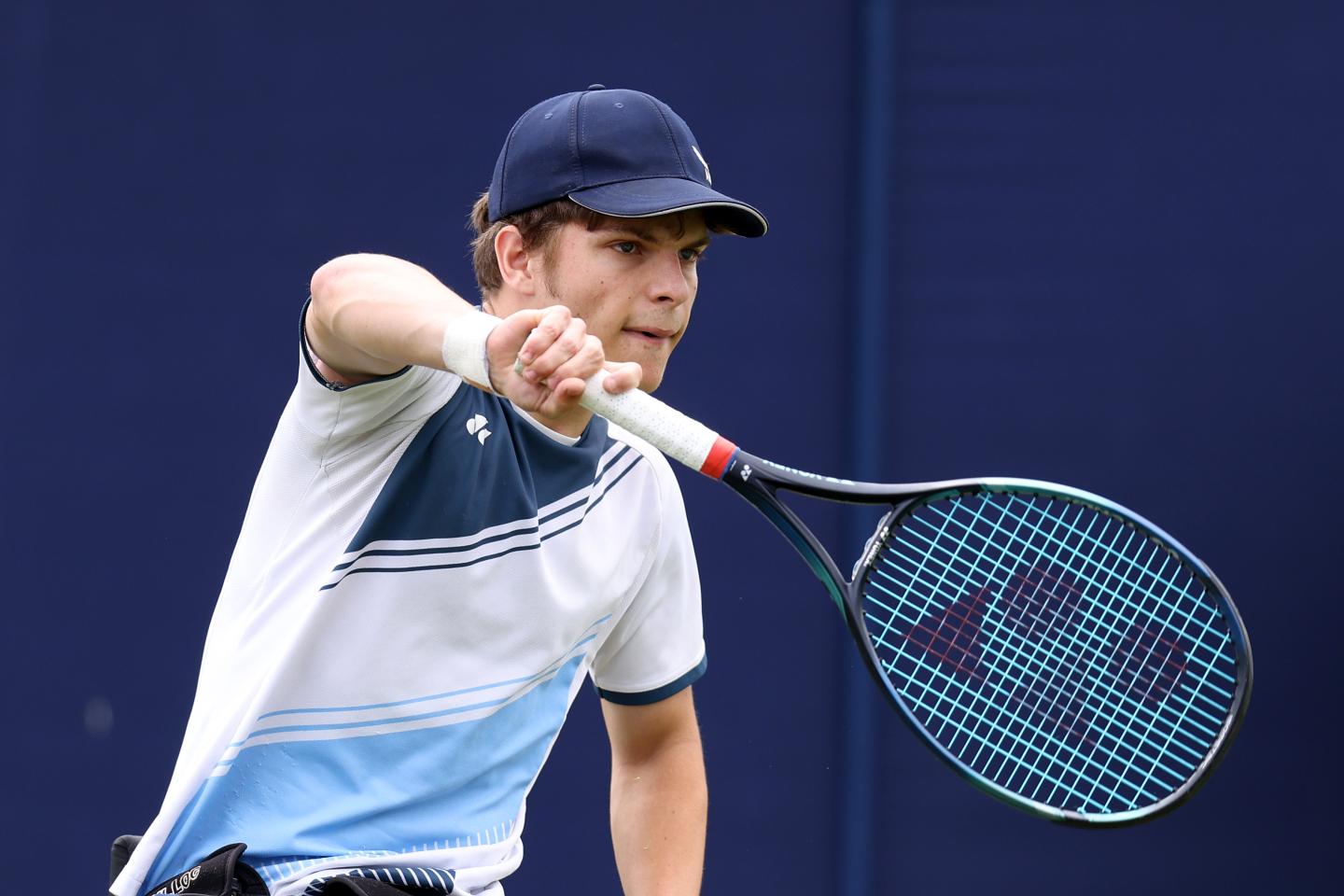 Greg Slade - Wheelchair tennis athlete preparing to return a back hand shot