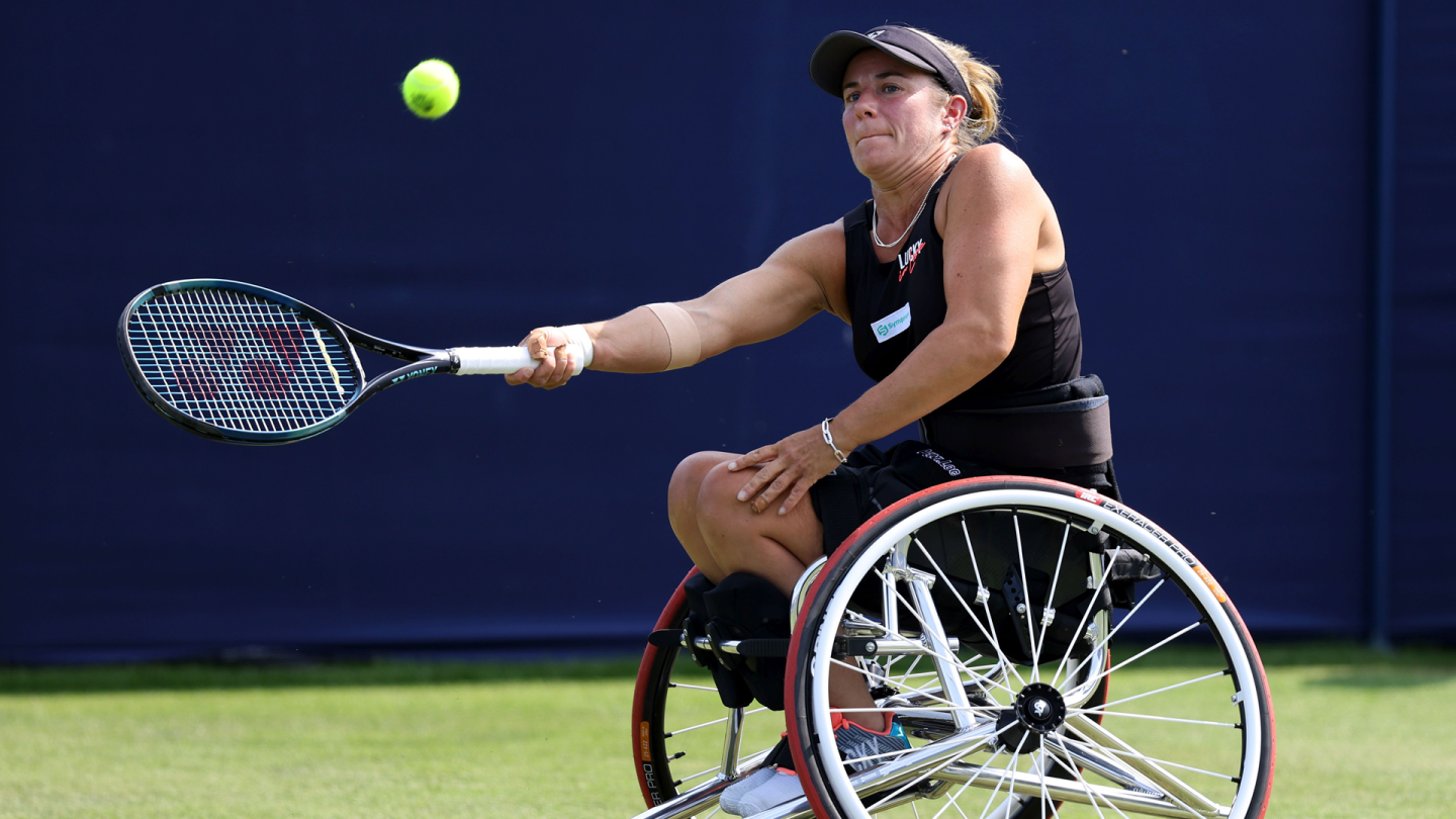 Wheelchair tennis athlete, Lucy Shuker, mid returning a forehand shot at Wimbledon 2023 - LTA Getty