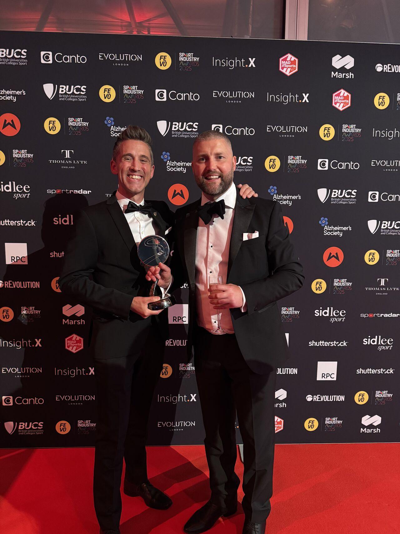 Every Body Moves members, Barry and Baden, collecting the Sport Industry Award prize for Sponsorship With A Social Purpose