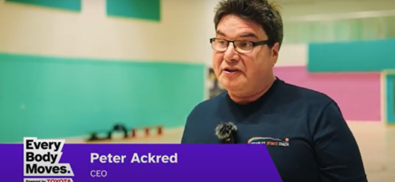 Peter Ackred as described in the article. Wears a blue DSC t-shirt with a sports hall as the backdrop.