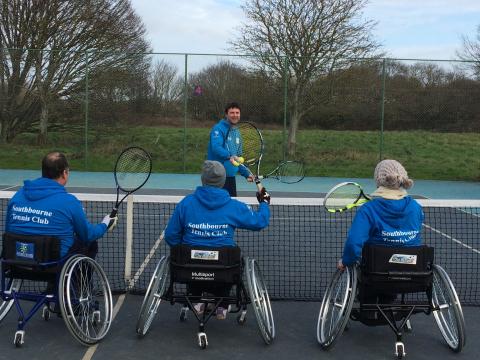 Group playing tennis