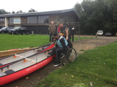 Picture of Wheelchair users getting into a Canadian Canoe