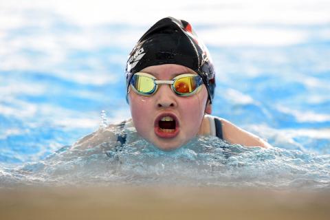 Young girl swimming in pool