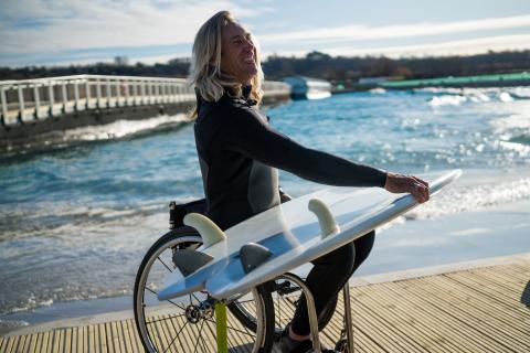 Bruno, adaptive surfer getting ready to enter the water