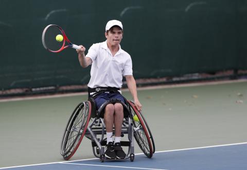 Greg Slade - Wheelchair tennis athlete playing a game back in 2020