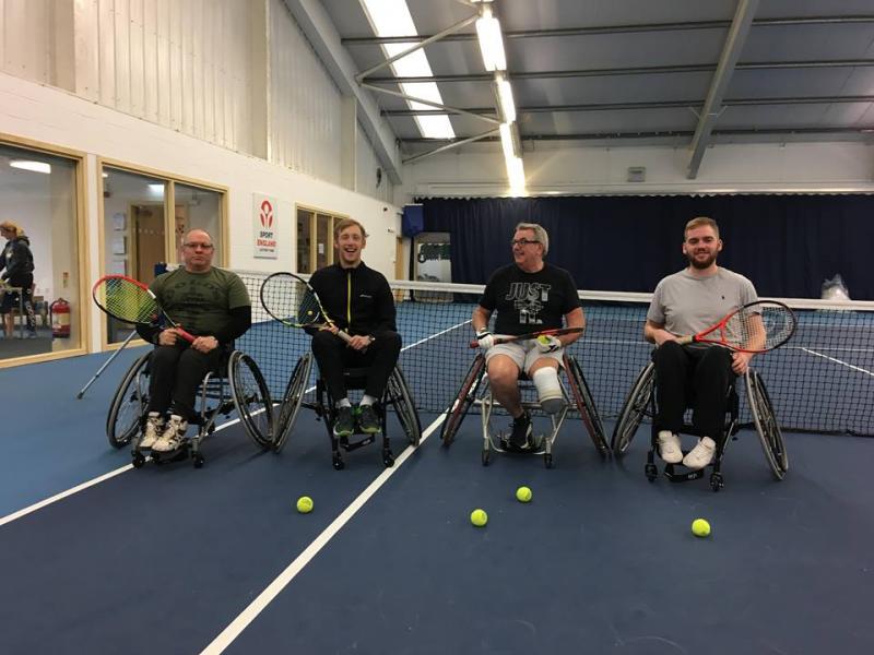 Players playing wheelchair tennis