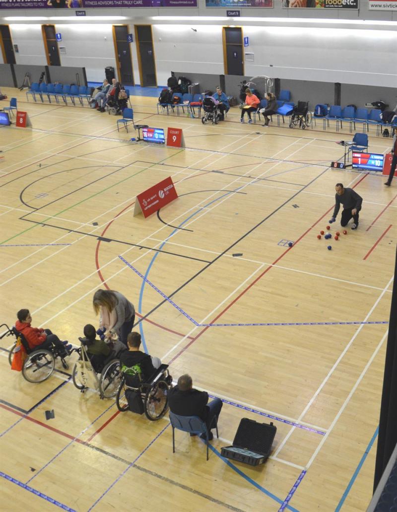 Boccia players playing a game of boccia