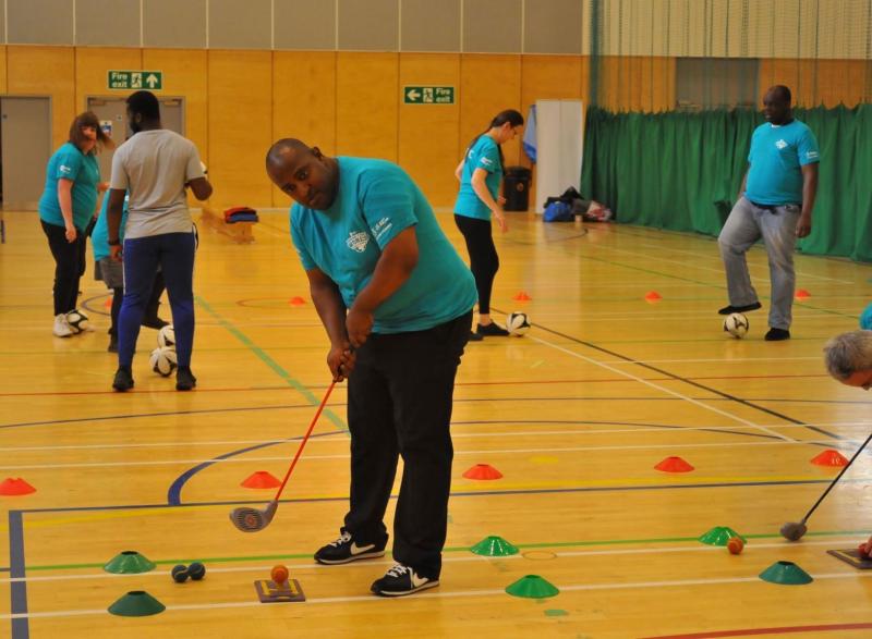 Participant engaging in some indoor golf