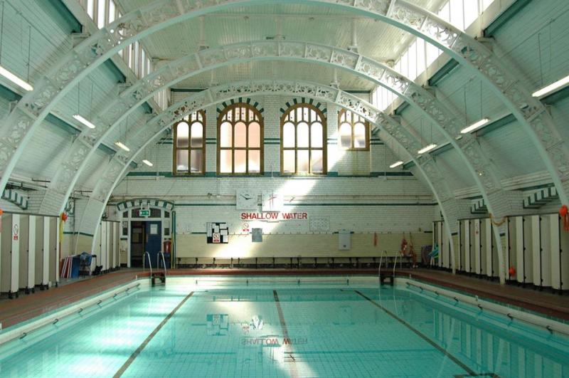 Moseley Road Baths - empty pool with tall ceilings and skylights