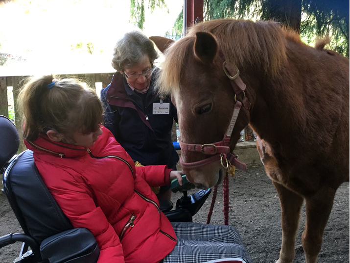 Holly loving a young rider in her wheelchair