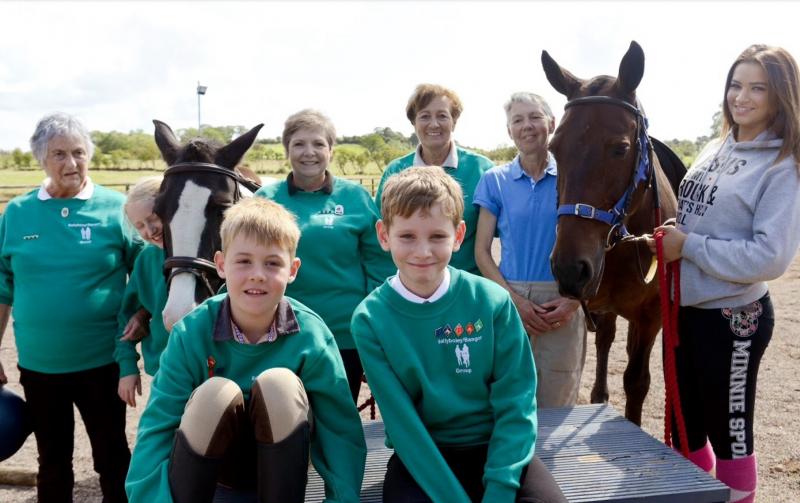 Young RDA students with instructors and horses