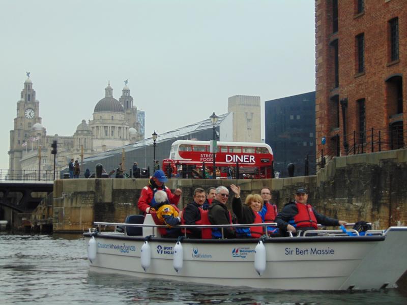 Participants enjoying the view of the Liver Buildings from the boat 