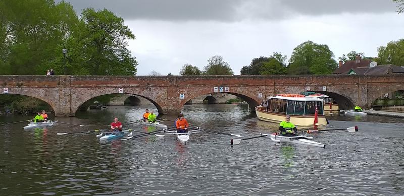 An adaptive squad outing showing 6 rowing boats