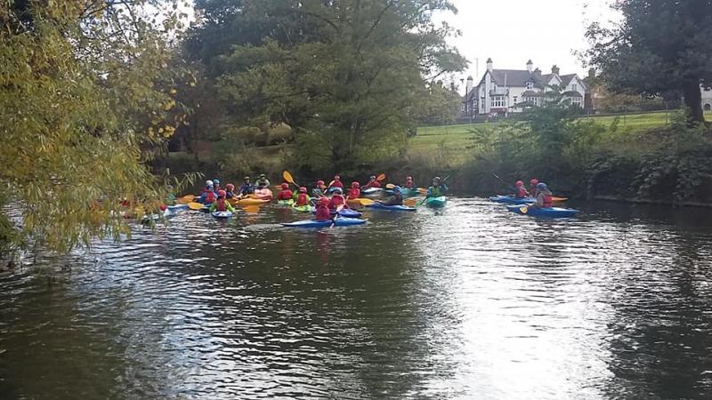 Group out for a recreational canoe session on the river