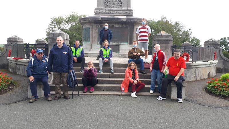 The picture shows a group of Able Raiders (adults with learning disabilities) in our local park, having taken part in a walk and sporting activities