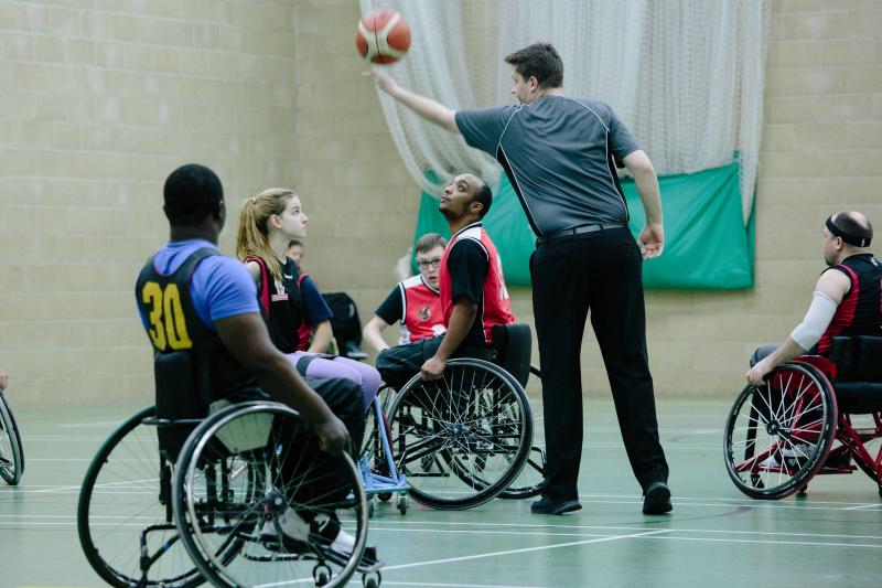 tip off at a wheelchair basketball game. 