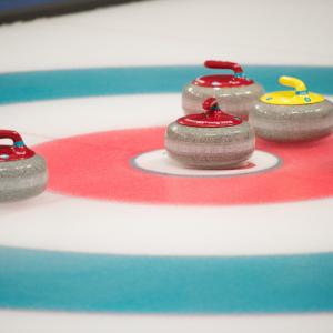 curling stones on the rink