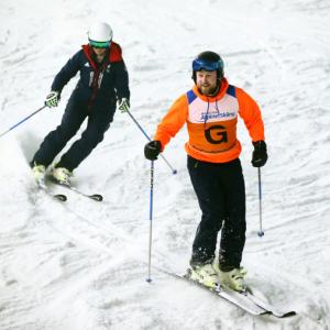 A visually impaired skier and her guide