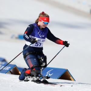 Female sit skiing athlete taking part in cross country skiing