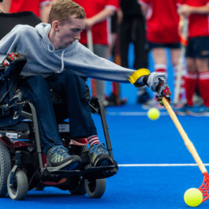 Boy in wheelchair playing Hockey