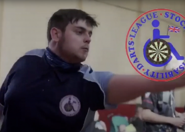 Stockport Disability Darts member engaging in a game of darts