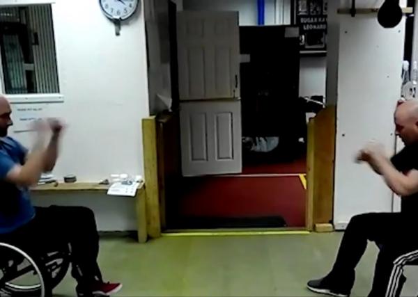 Chris conducts a shadow boxing session with another member