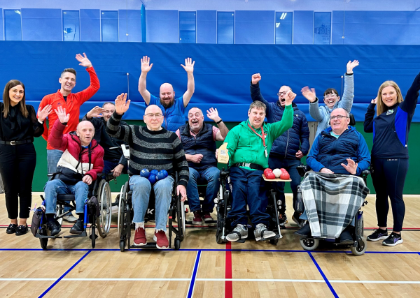 Craigavon Boccia club - image showing all club members being presented with their Every Body Moves club of the month trophy.