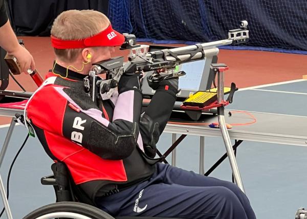 Paul Barker sat in his wheelchair aiming his rifle at a target